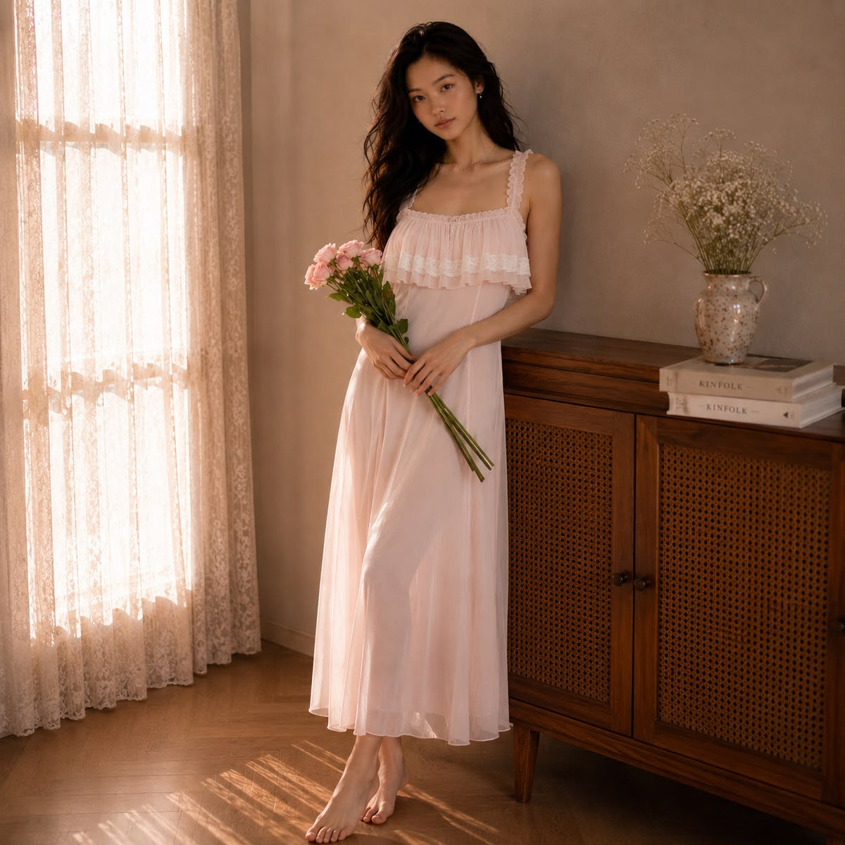 Aurelia Slip Dress blush pearl — full length fluid silhouette with adjustable straps, standing by window