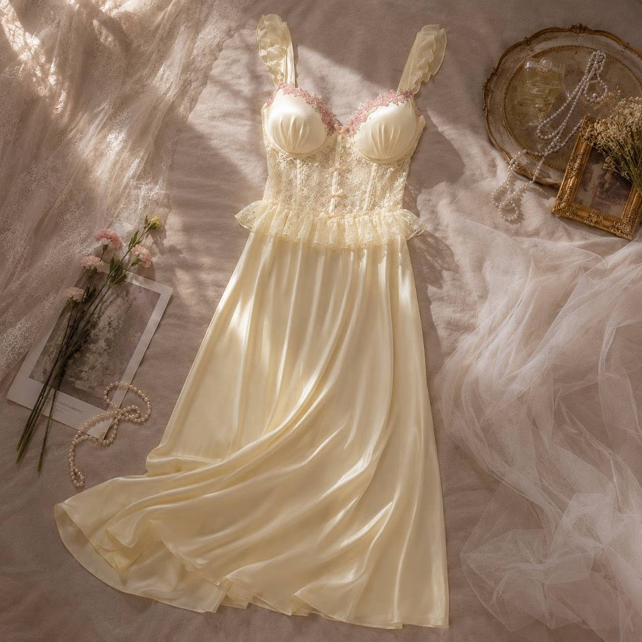 Dove Maxi Nightgown pale yellow — flat lay showing structured lace bodice with pink floral embroidery and fluid satin skirt