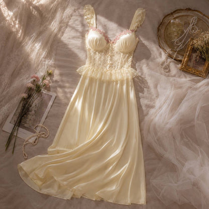 Dove Maxi Nightgown pale yellow — flat lay showing structured lace bodice with pink floral embroidery and fluid satin skirt