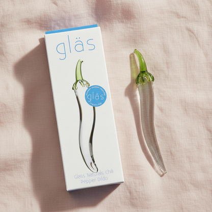 Overhead with packaging on blush pink linen