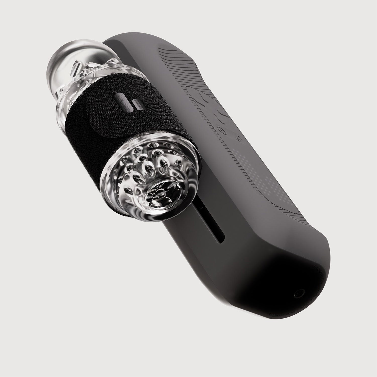 Black and clear handheld grinder on a light gray background
